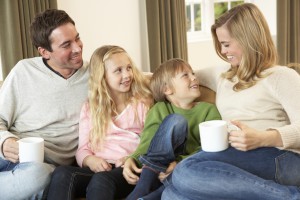 Parents and kids on sofa