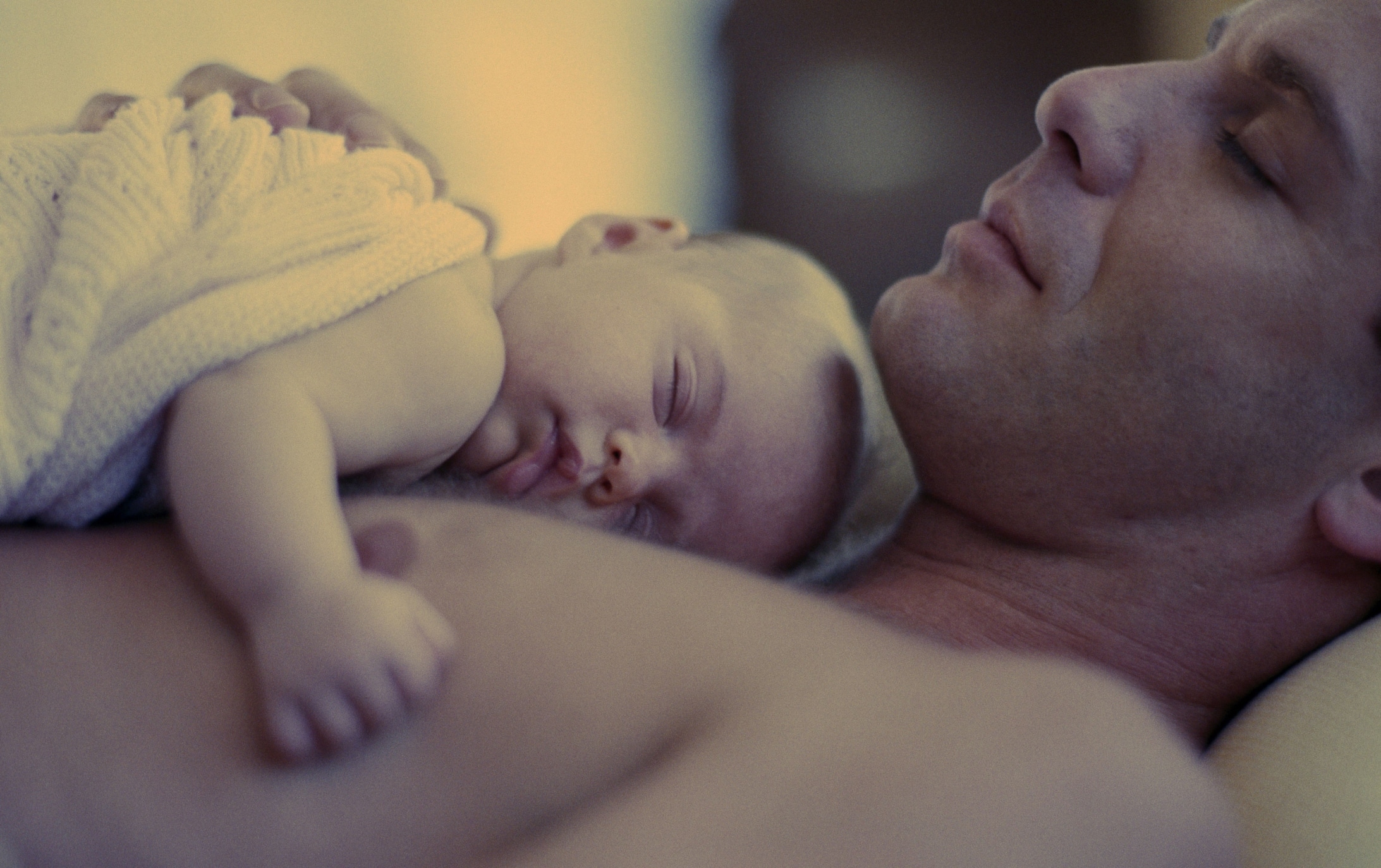 Picture of baby and father sleeping