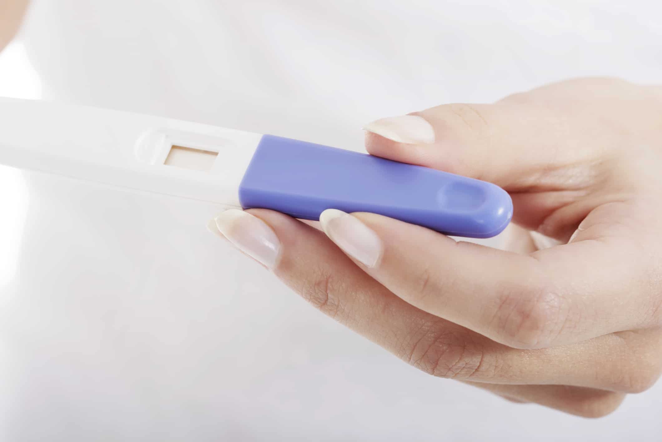 Picture of woman holding pregnancy test