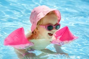 little girl having fun in the pool