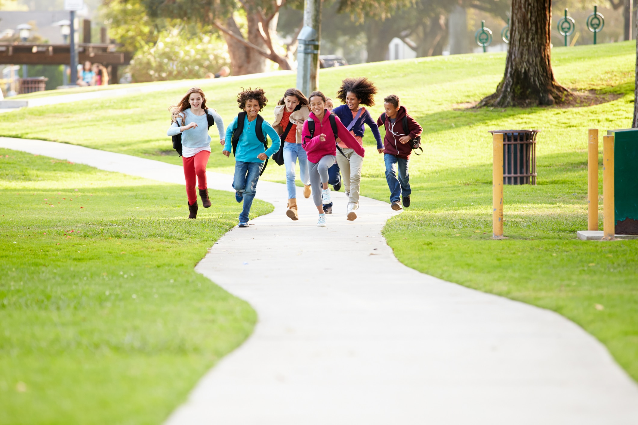 Image of kids running down a path