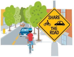 Share the road sign with car and bike