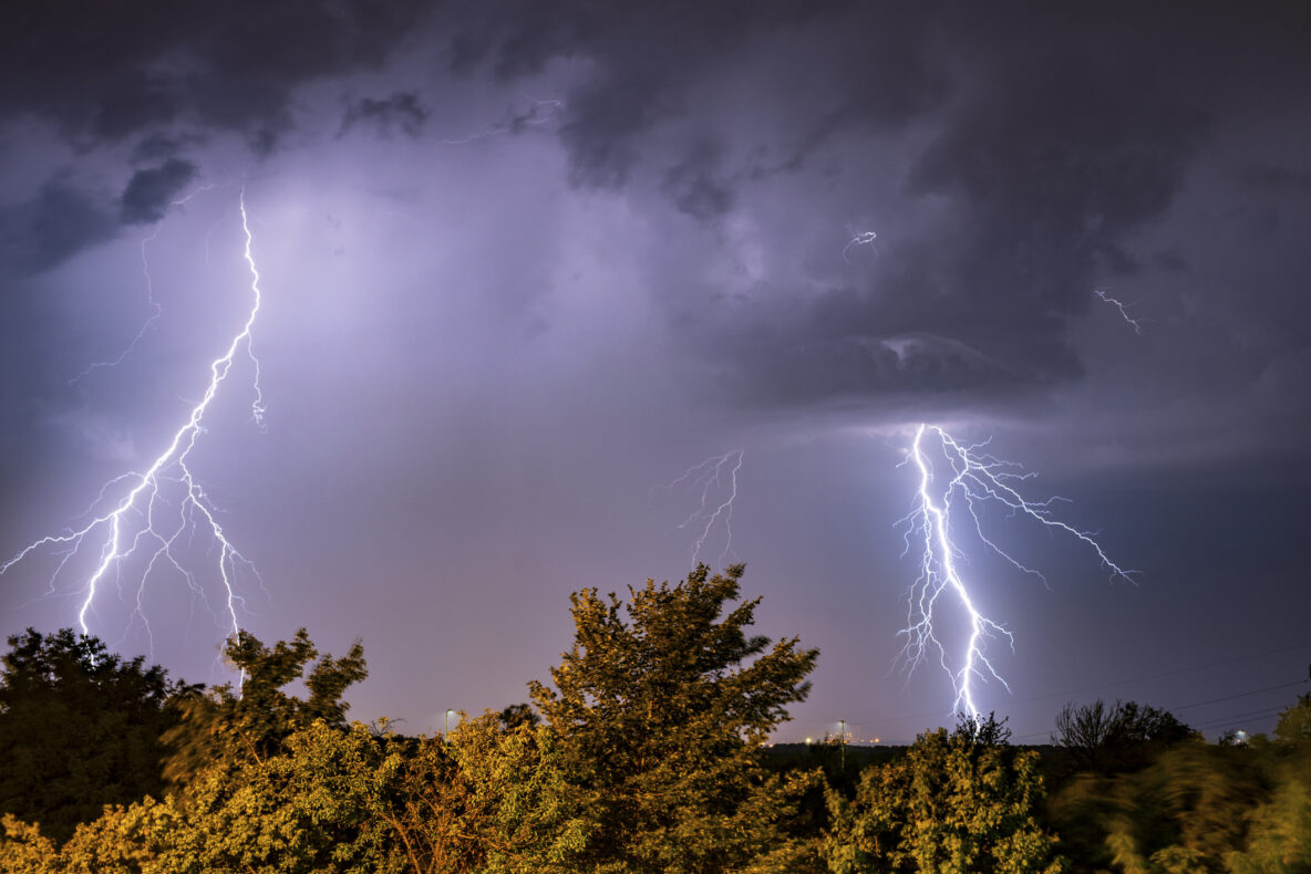 Lightning strike over trees